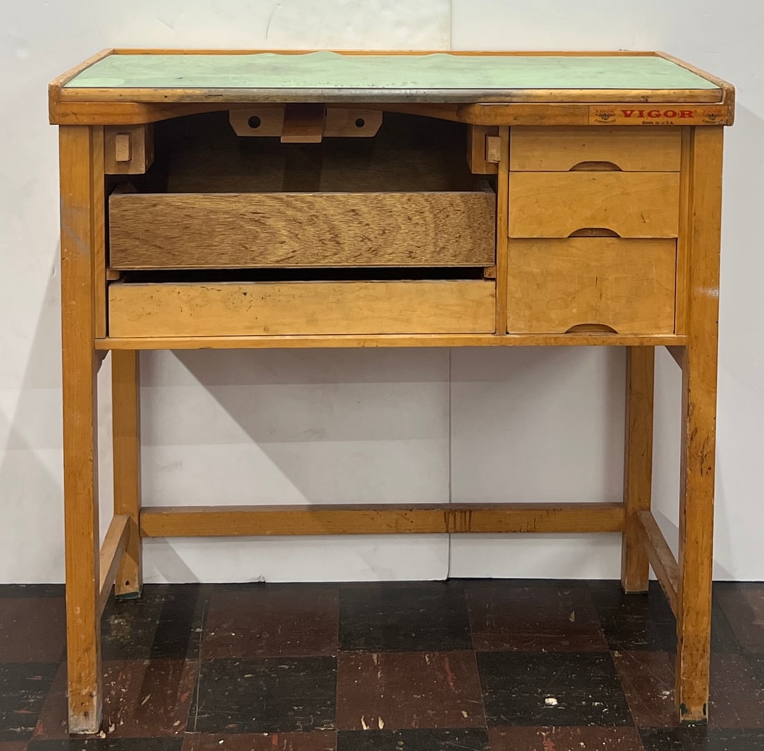 Vigor Work Desk: Vintage Vigor brand work desk with a light green top, open storage, and three drawers. Marked "Vigor Made in U.S.A." Measures approximately 39 x 39 inches.