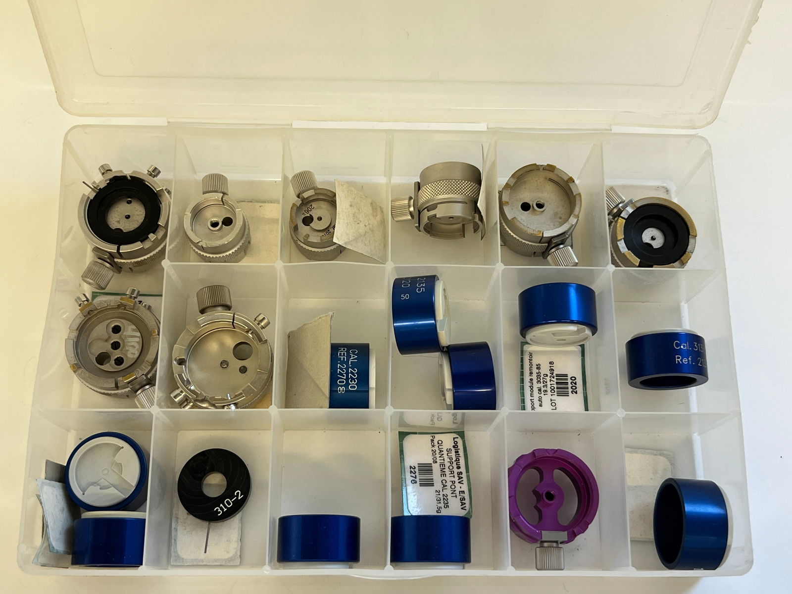 Watch Movement Holders & Parts - Assorted: Collection of watch movement holders and various parts, including blue and silver toned components. Assorted sizes and styles. Sold as is. Includes holders for: Individual Rolex caliber - 3130 - 2020