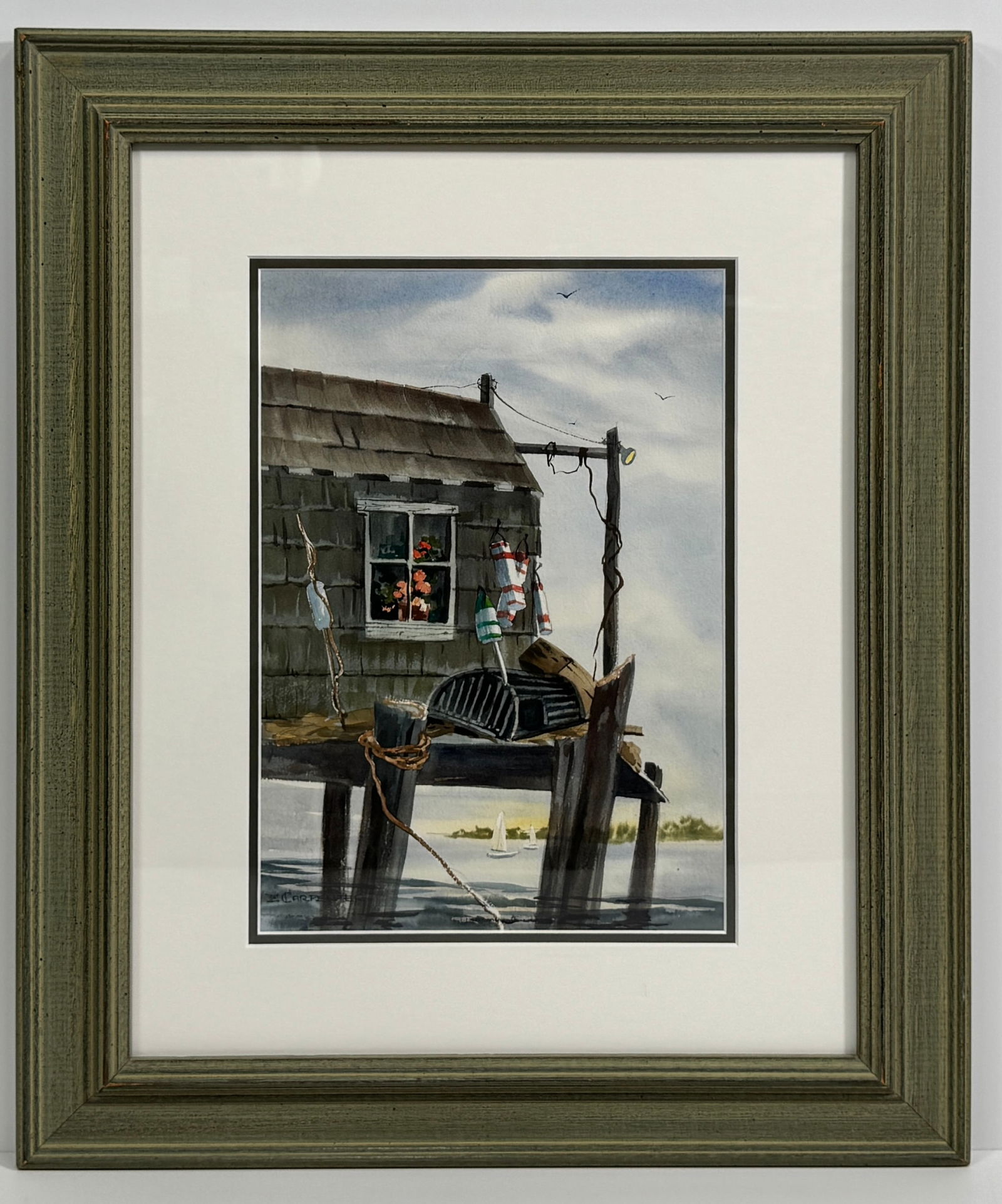 Ethel Carpenter (1917-2005) Watercolor: Watercolor painting of a shack on stilts over water, signed "E. Carpenter". Framed and matted with provenance on reverse.Framed dimensions: 24.5 x 20.5 inches.