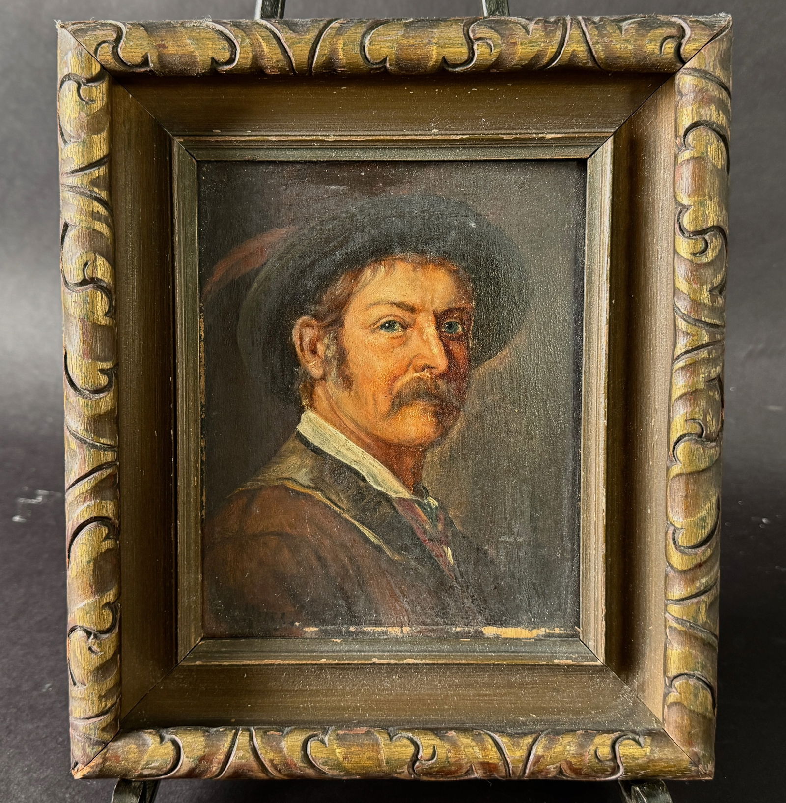 Framed Portrait Painting of a Man: Small framed portrait painting of a man with a mustache and hat. Frame dimensions: 9.5 x 8.25 inches. Sight dimensions: 6.25 x 5 inches. 