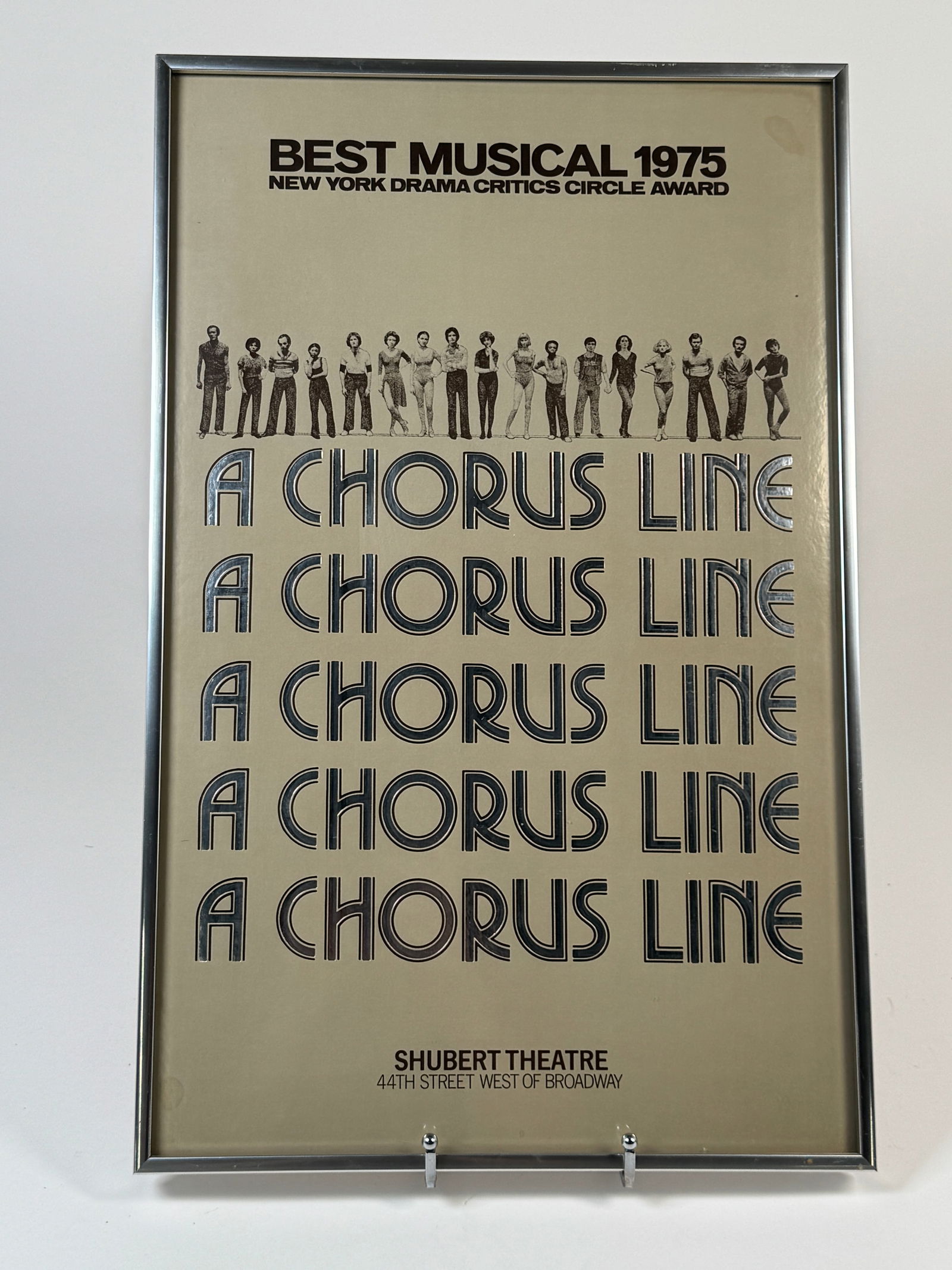 "A Chorus Line" Poster, Shubert Theatre: "A Chorus Line" window car, winner of the 1975 New York Drama Critics Circle Award for Best Musical. Displayed at the Shubert Theatre. Dimensions: 22.25 x 14.25 inches. Framed.