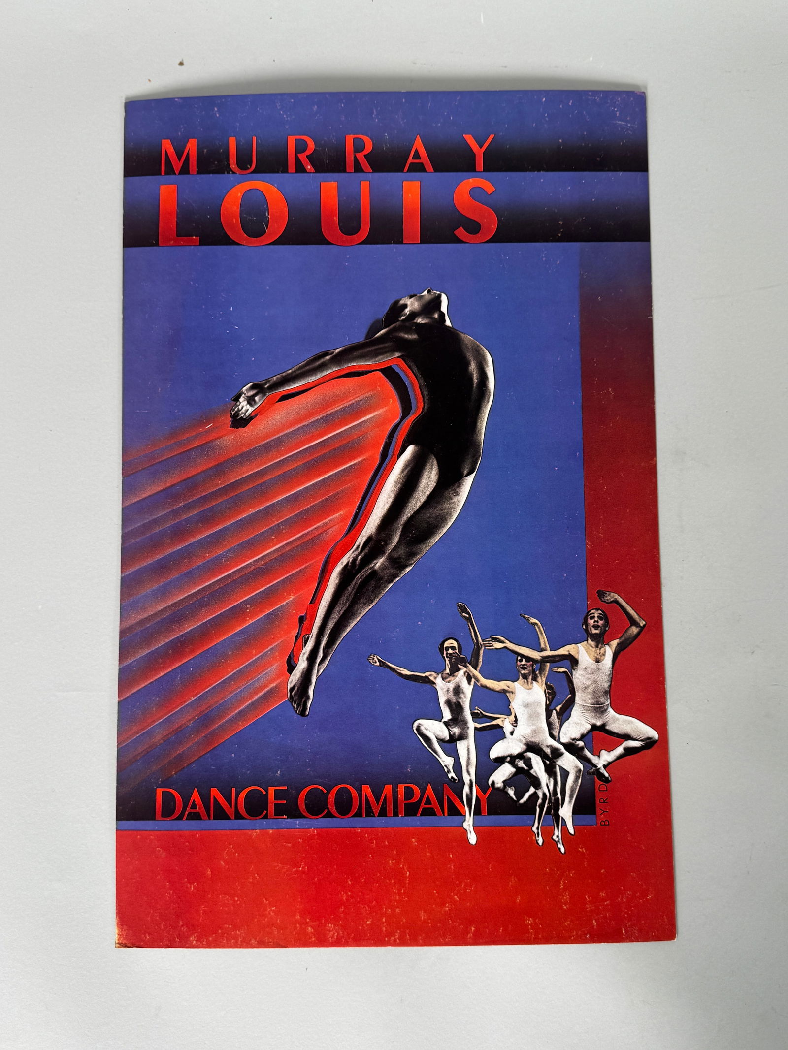 Murray Louis Dance Company Poster: Vintage poster for the Murray Louis Dance Company. Features dancers in motion against a blue and red background. Dimensions: 22 x 14 inches.