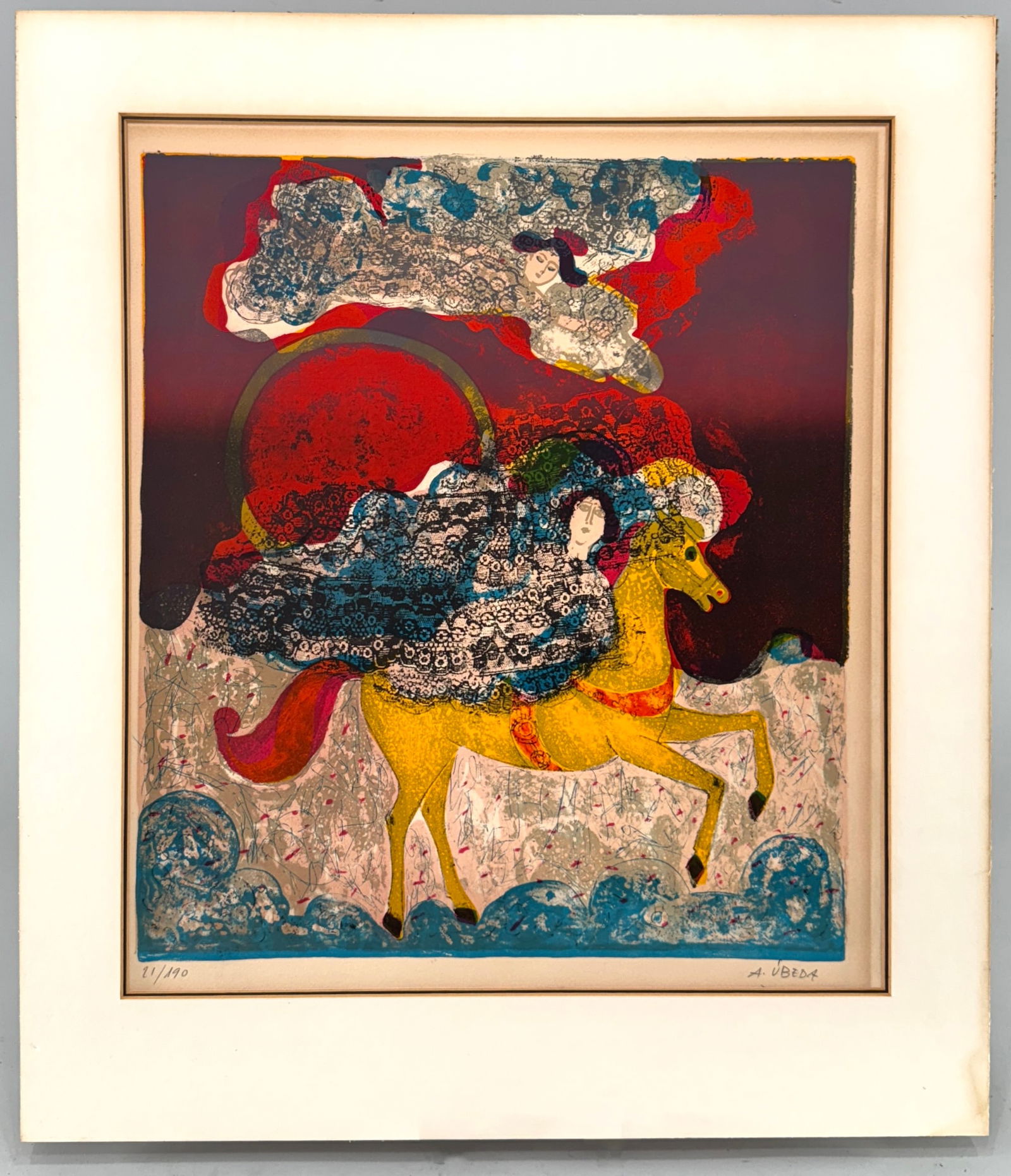 Augustin Ubeda, Limited Edition Lithograph, 21/190: Limited edition lithograph by Augustin Ubeda, numbered 21/190. Depicts a figure riding a horse with surreal, colorful elements. Framed. Print: 20 1/8 x 17 1/2 inches. Frame: 26 x 22 1/2 inches.