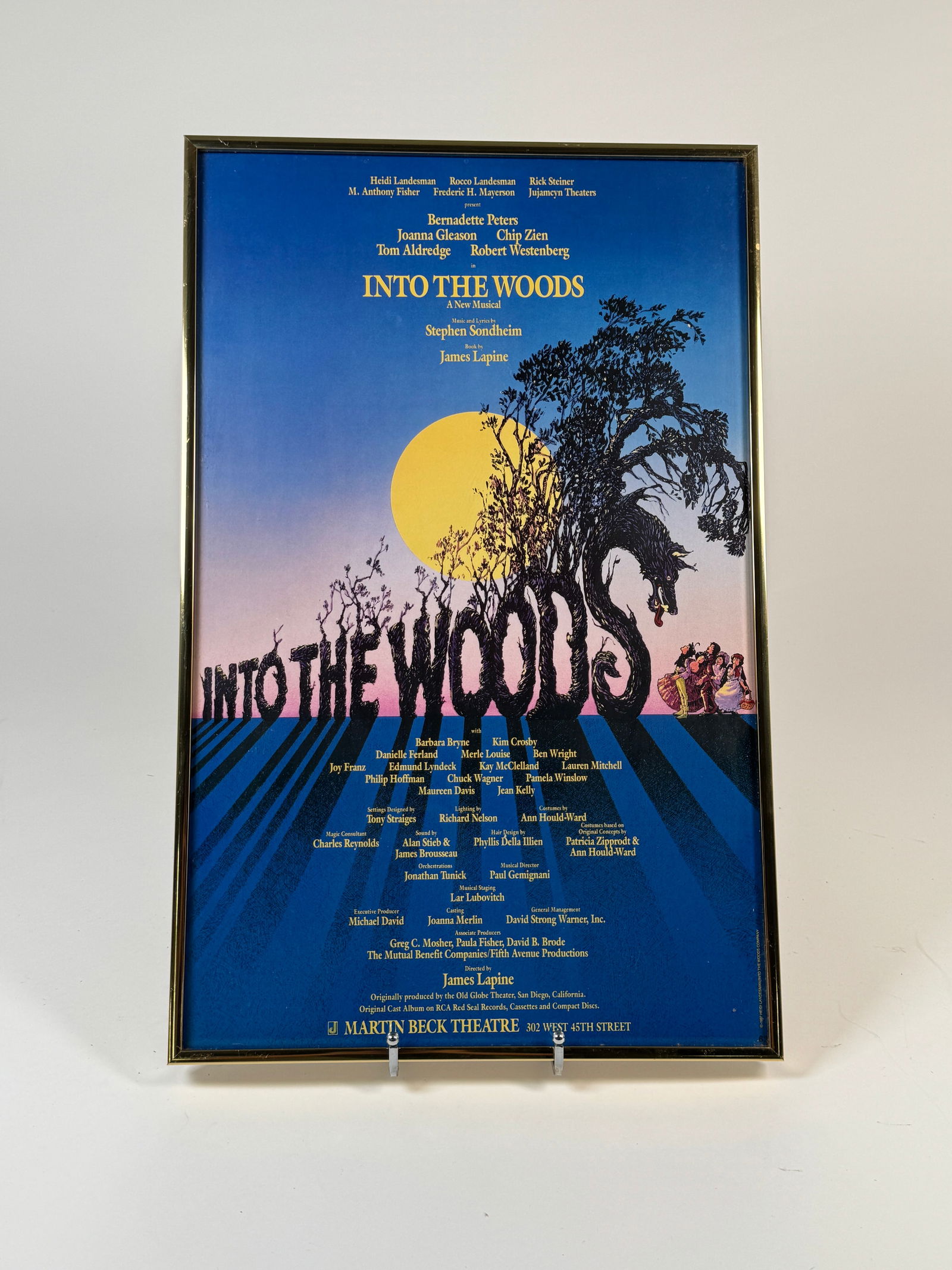 Framed 'Into the Woods' Broadway Poster, 1987: Framed poster for the Broadway musical 'Into the Woods'. Features the original cast and artwork. Dimensions: 22.25 x 14.25 inches. 
