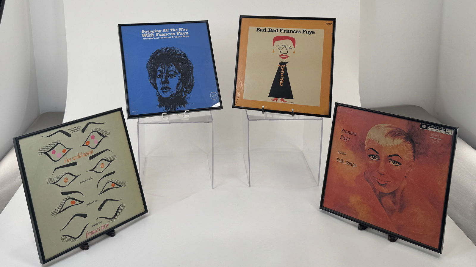 Four Framed Frances Faye Album Cover Art: Four framed album covers featuring Frances Faye. Each piece measures approximately 12 7/8 x 12 7/8 inches. Includes "Bad, Bad Frances Faye", "Frances Faye Sings Folk Songs",