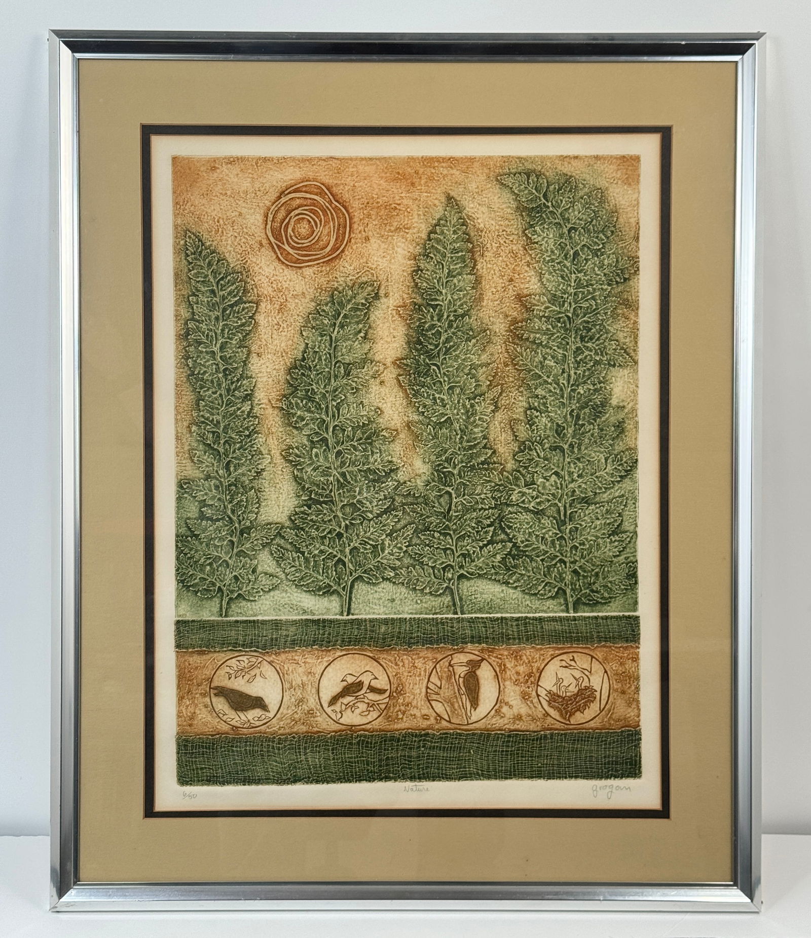 Robert Grogan Etching: Framed etching print by Robert Grogan featuring a stylized landscape with ferns and circular vignettes of birds. Frame: 31.5 x 25.5 inches. Print: 24.25 x 18.375 inches.