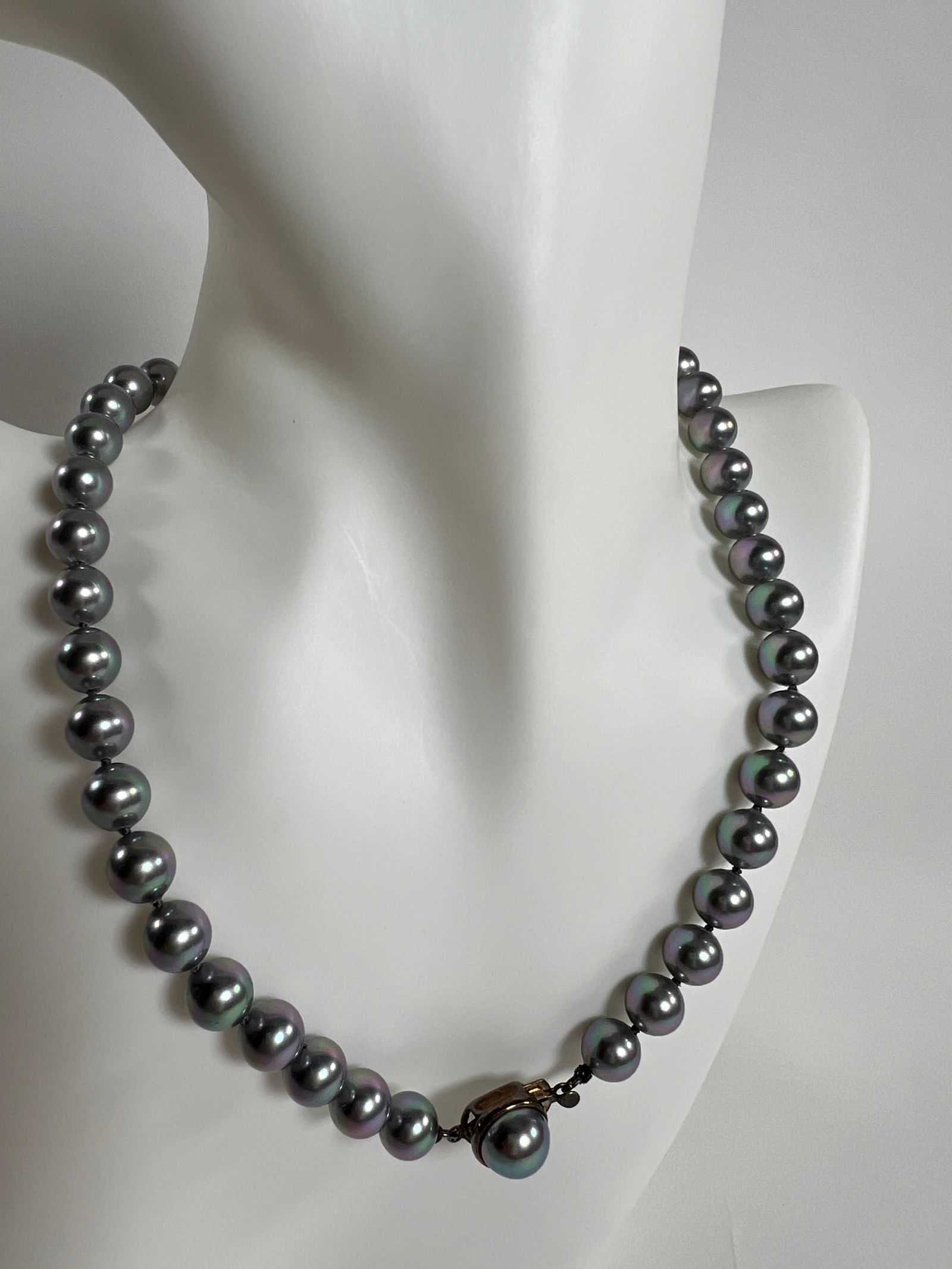 Gray Pearl Necklace: Gray pearl necklace, weighing 1.4 oz and measuring 7.75 inches long when closed. Features a decorative 925 silver clasp.