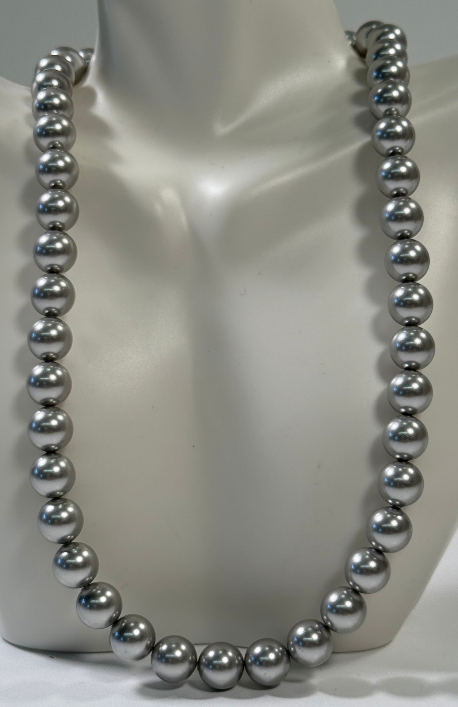Gray Pearl Bead Necklace with Rhinestone Clasp: A strand of gray pearl beads, likely glass or simulated pearls, forming a necklace. Features a rhinestone-studded clasp. Length approximately 17 inches.