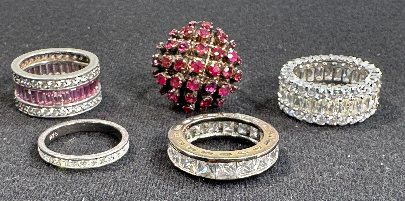 Five Assorted Gemstone and Diamond Rings: Collection of five rings featuring various gemstones and diamonds. Sizes 7.5, 7.25, 8.5, 7.25. Includes ruby cluster ring and diamond eternity bands.