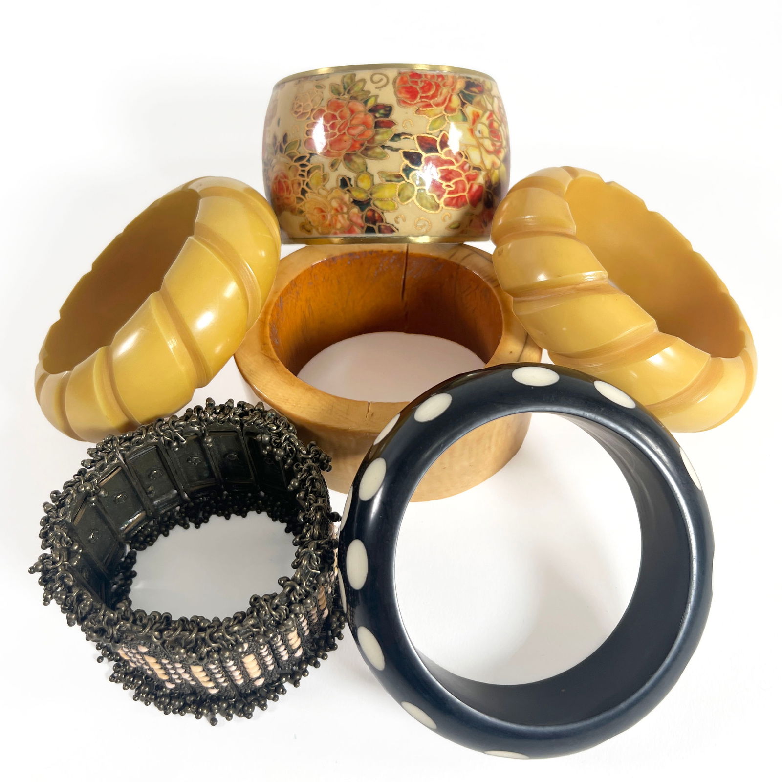 Vintage Bangle Bracelet Assortment (6): Collection of six vintage bangle bracelets. Includes floral enamel, two carved yellow, a black polka dot, one black with beaded style, and a yellow bangle. Weight: 623.7g