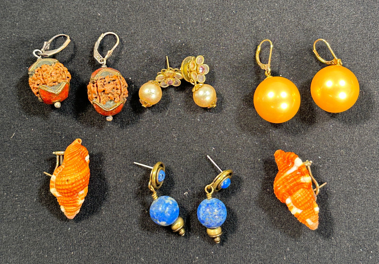 Assorted Costume Earrings - 5 Pairs: Collection of 5 pairs of costume earrings. Includes carved beads, faux pearls, lapis style beads, and shell earrings. Largest pair measures approximately 1.5 inches. Total weight: 2.3 oz.