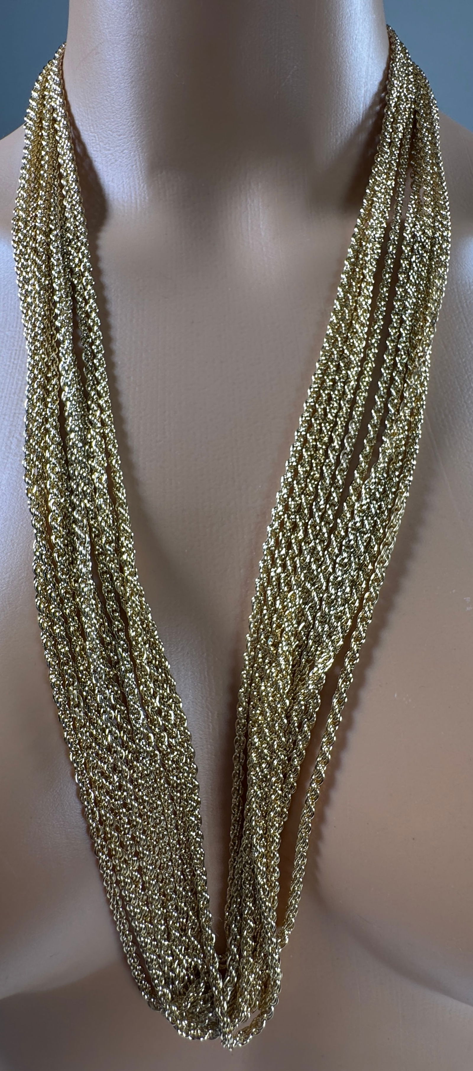 Collection of Costume Gold Tone Chain Necklaces: 12 gold tone necklaces. Weight: 6 oz.