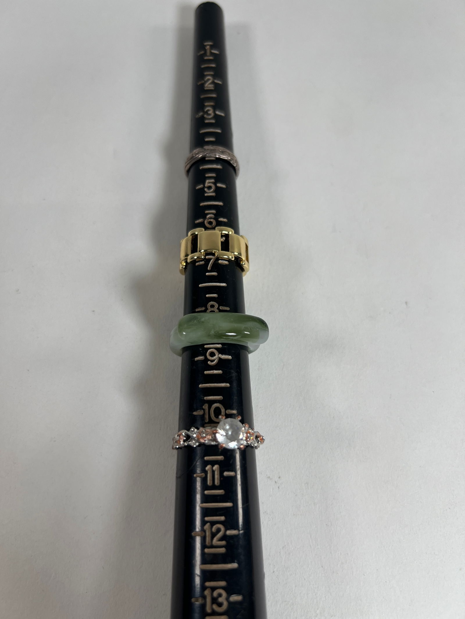 Assorted Costume Rings - Group of 13: A collection of 13 assorted costume rings in varying styles and sizes, ranging from 3.75 to 10.5. Includes gold-tone, silver-tone, and colored stone rings. sizes: 4, 6.5, 8.5, 10.5, 6, 9, 8.25, 10, 8,