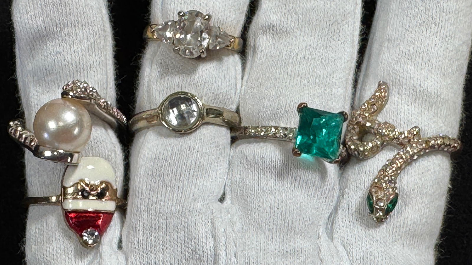 Assorted Costume Rings - 6 Pieces: Collection of six costume rings featuring various designs including a snake, pearl, and colored stones. Sizes range from 5 to 8. Weight: 0.7 oz. Sizes: 5, 6.25, 7.75, 8.75, 5, 8