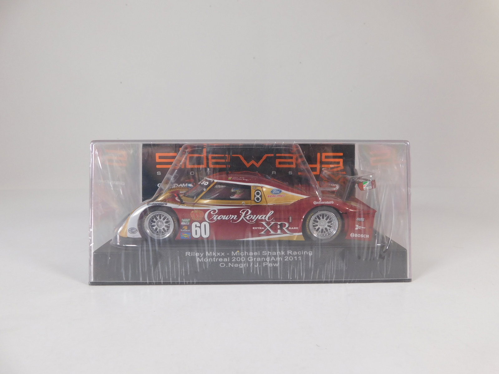 Sideways Riley MkXX Montreal 200 GrandAm 2011 #60: Sideways Riley MkXX Michael Shank Racing Montreal 200 GrandAm 2011 O.Negri/J.Pew #60 Crown Royal 1/32 Slot Car. Reference #SW12, with original case. Weight: 7 oz. 