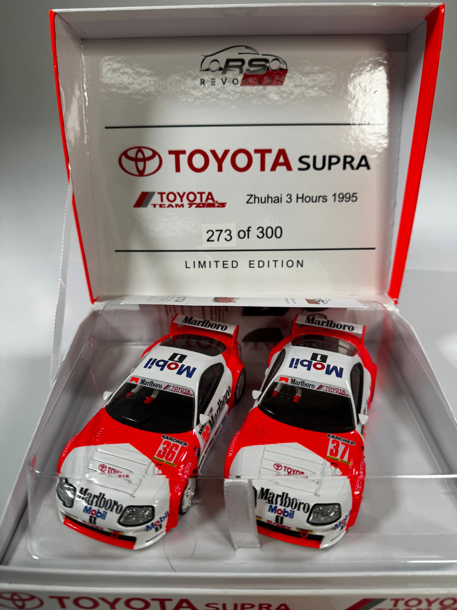 RevoSlot Toyota Supra Zhuhai 3 Hours 1995 Slot Car Set: RevoSlot Toyota Supra Zhuhai 3 Hours 1995 Slot Cars #36 #37 Mobil1 - Marlboro 1/32 Slot Cars, with original case. Case length: 8.75 inches. Weight: 18 oz. Limited edition 273 of 300.