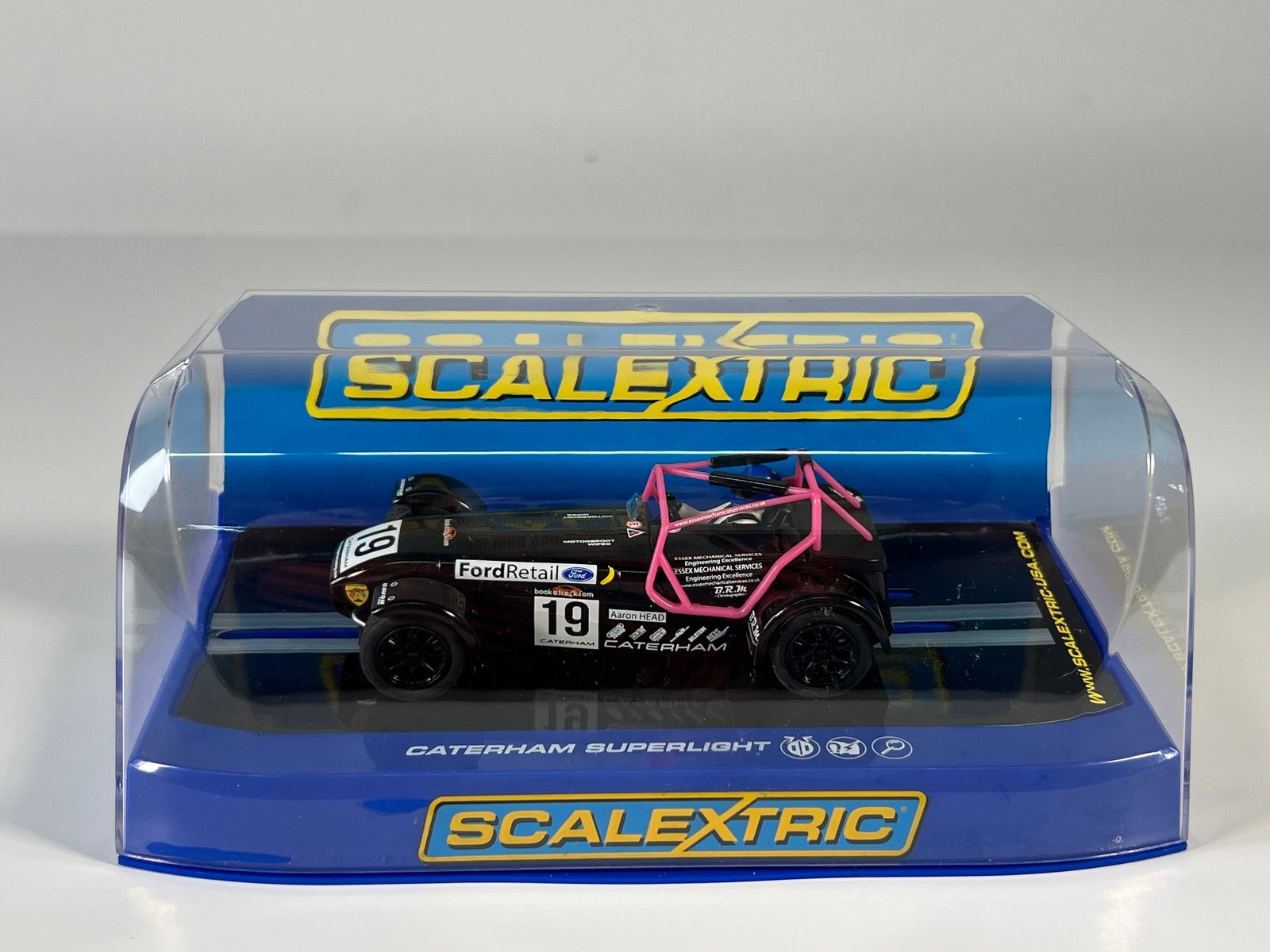Scalextric Caterham Superlight Championship 2014 #19: Scalextric Caterham Superlight Championship 2014 Aaron Head #19 Ford Retail 1/32 Slot Car. Reference #C3647, with original case. Weight 8 oz.