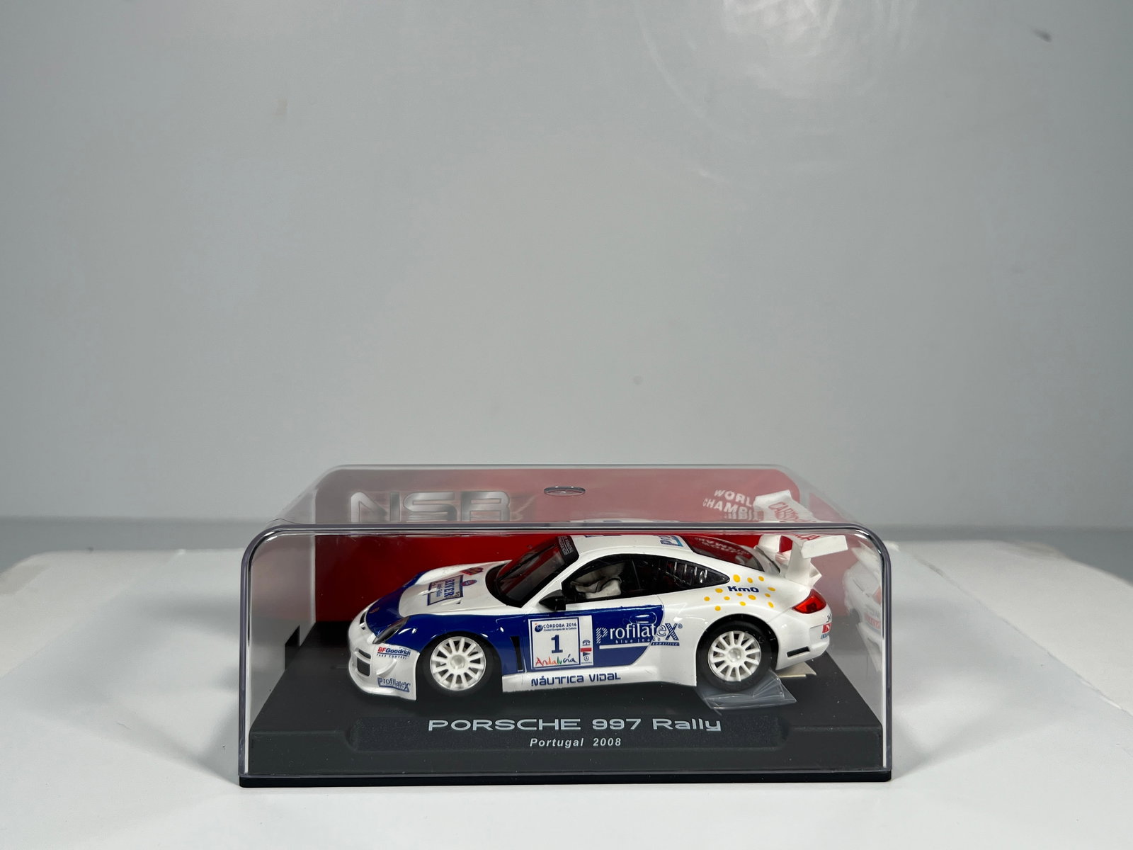 NSR Porsche 997 Rally Portugal 2008 #1: NSR Porsche 997 Rally Portugal 2008 #1 Cabreiroa 1/32 Slot Car 1078, with original case. Weight: 7 oz.