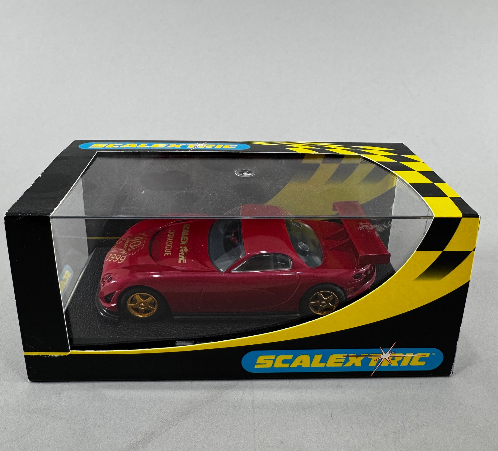 Scalextric TVR Speed 12 40th Anniversary Scalextric Catalogue: Scalextric TVR Speed 12 40th Anniversary Scalextric Catalogue 1/32 Slot Car, with original case. Weight: 8 oz.