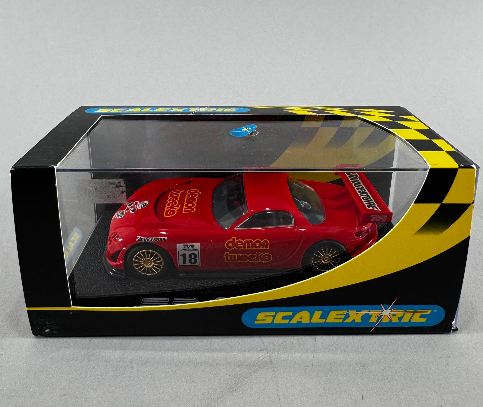Scalextric TVR Speed 12 #18: Scalextric TVR Speed 12 #18 demon tweeks 1/32 Slot Car, with original case. Weight: 8 oz.