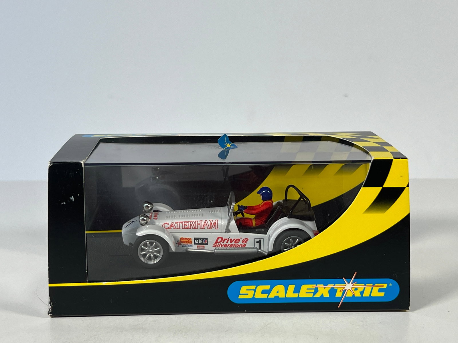 Scalextric Caterham Super Seven #1: Scalextric slot car featuring a Caterham Super Seven race car, number 1, in original box.