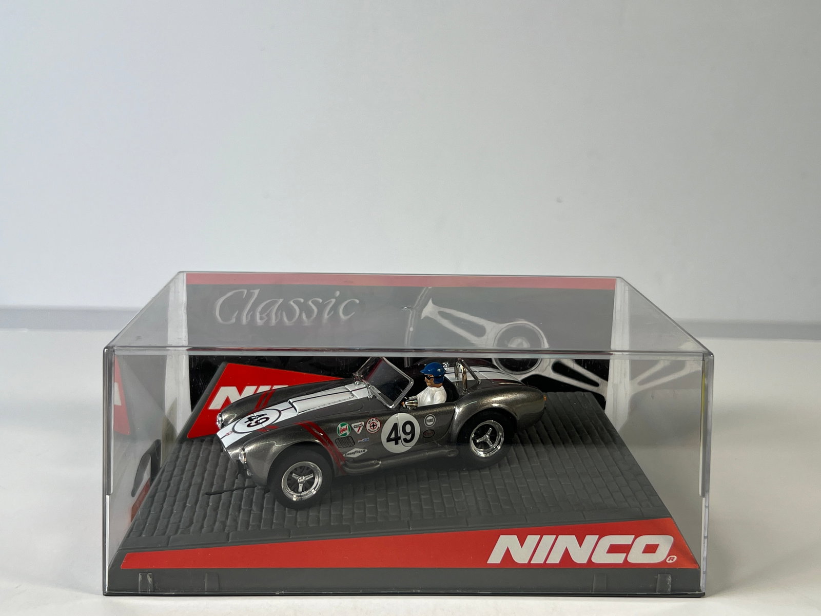 Ninco Classic AC Cobra Thames Ditton #49: Ninco Classic AC Cobra Thames Ditton #49 1/32 Slot Car. Reference #50503, with original case. Weight: 9 oz.