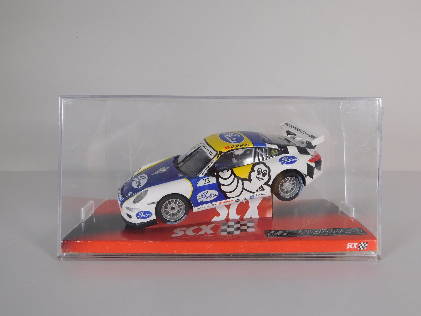 SCX Porsche 911 GT3 Cup Michelin #33: SCX Porsche 911 GT3 Cup Michelin #33 Gates 1/32 Slot Car. Reference #64680, with original case. Weight: 9 oz.