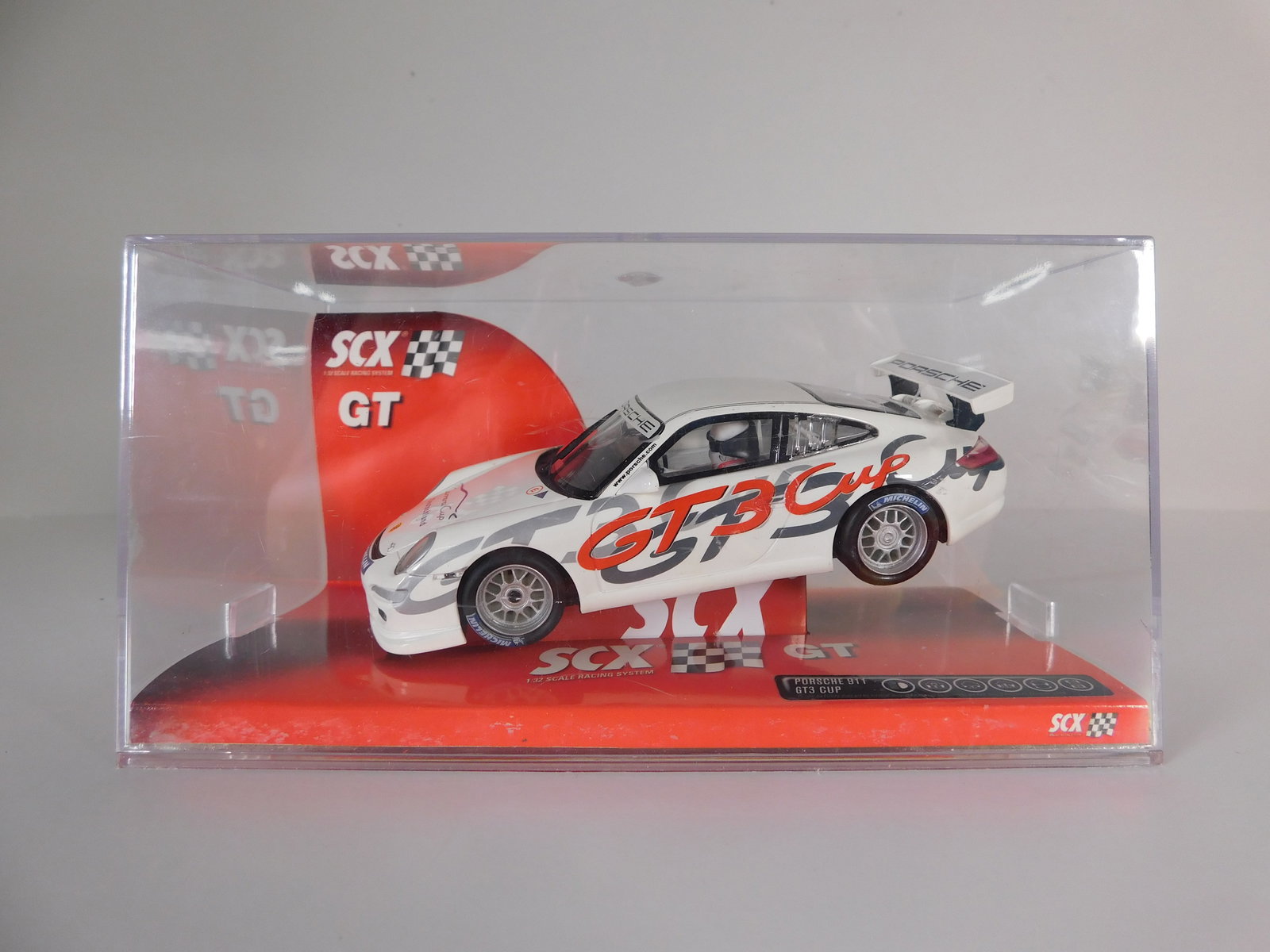 SCX Porsche 911 GT3 Cup: SCX Porsche 911 GT3 Cup Michelin-Mobil1 1/32 Slot Car. Reference #62810, with original case. Weight: 9 oz.