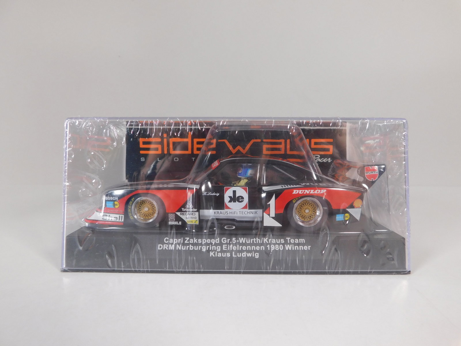 Sideways Capri Zakspeed Gr. 5 Nurburgring Eifelrennen 1980 Winner #1: Sideways Capri Zakspeed Gr. 5 Wurth/Kraus Team DRM Nurburgring Eifelrennen 1980 Winner Klaus Ludwig #1 1/32 Slot Car. Reference #SW48. Chassis / Motor Ref. #SW29, with original case. Weight: 8 oz.&nbs