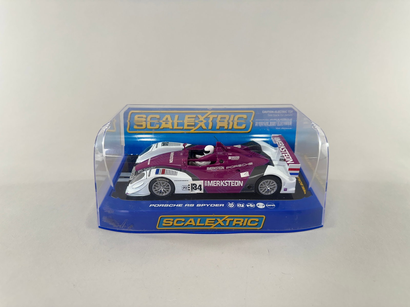 Scalextric Porsche RS Spyder #34: Scalextric Porsche RS Spyder 1/32 slot car, #34, Merksteon Porsche livery. In original packaging. Reference #C3015. Weight 10 oz. Dimensions: 7 1/8'' x 4'' x 3 1/8''. 