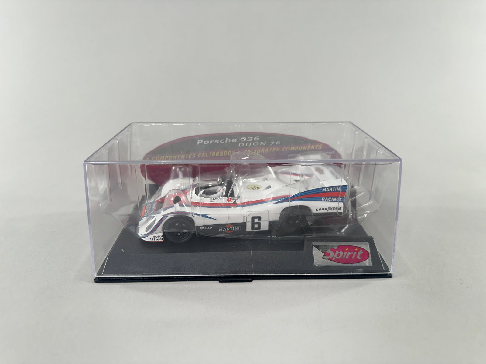 Spirit Porsche 936 Dijon 76 #6: Spirit Porsche 936 Dijon 76 1/32 slot car. White with Martini Racing livery and number 6. In original display case. Weight: 7.6oz. Size: 7'' x 4'' x 2 3/4''. 