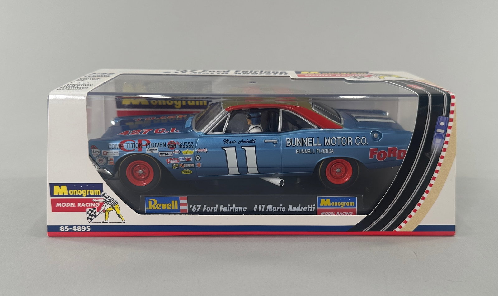 Monogram '67 Ford Fairlane #11 Mario Andretti: Revell/Monogram '67 Ford Fairlane #11 Mario Andretti slot car in original packaging. 1/32 scale. Weight 10 oz. Size: 7'' x 3 1/2'' x 2 5/8''.