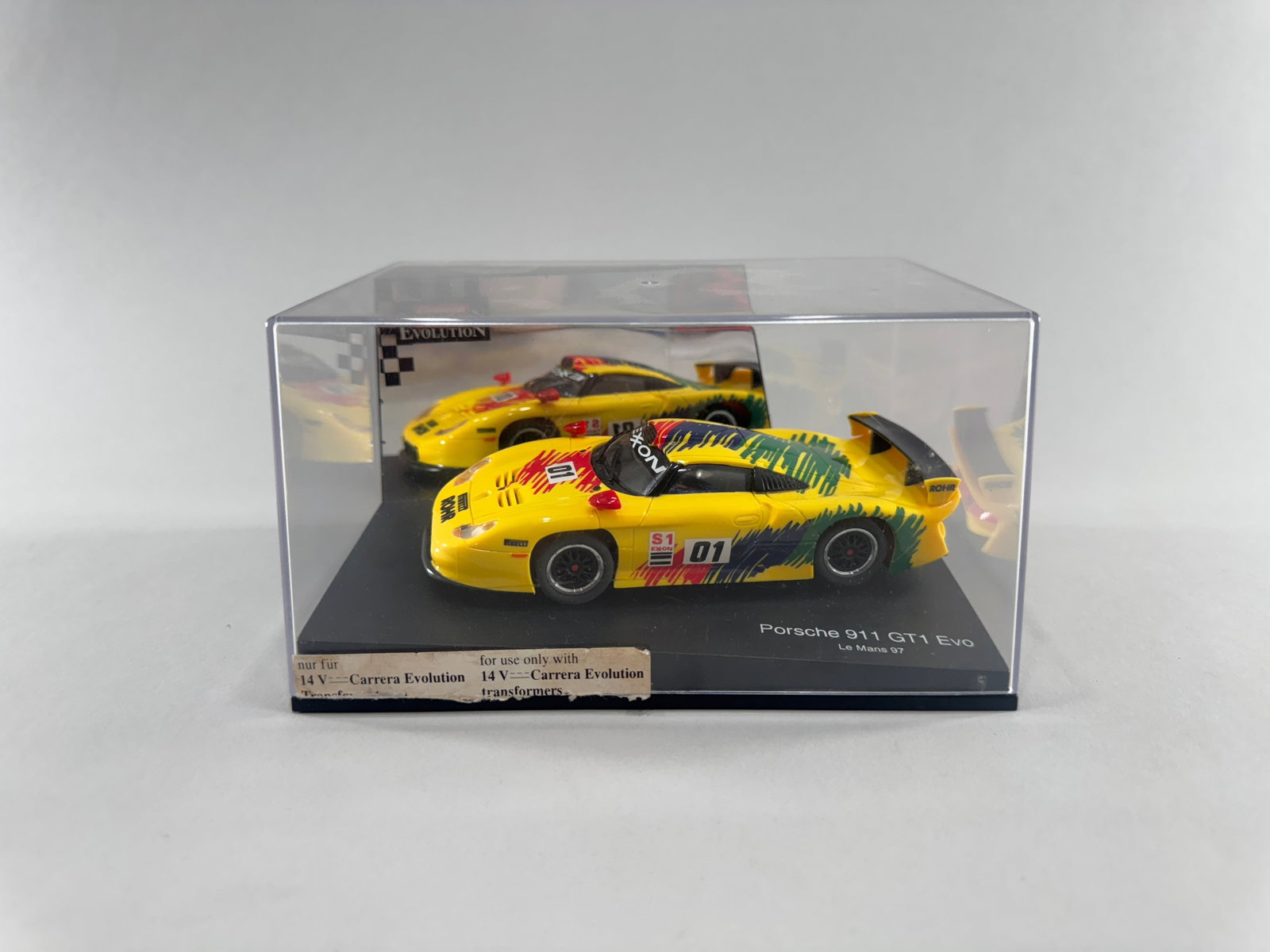 Carrera Evolution Porsche 911 GT1 Evo Le Mans 97 #01: Carrera Evolution Porsche 911 GT1 Evo Le Mans 97 #01 Exon 1/32 Slot Car. Reference #25401. Weight: 12.2oz. Dimensions: 7 1/4'' x 5 1/8'' x 3 7/8''. 