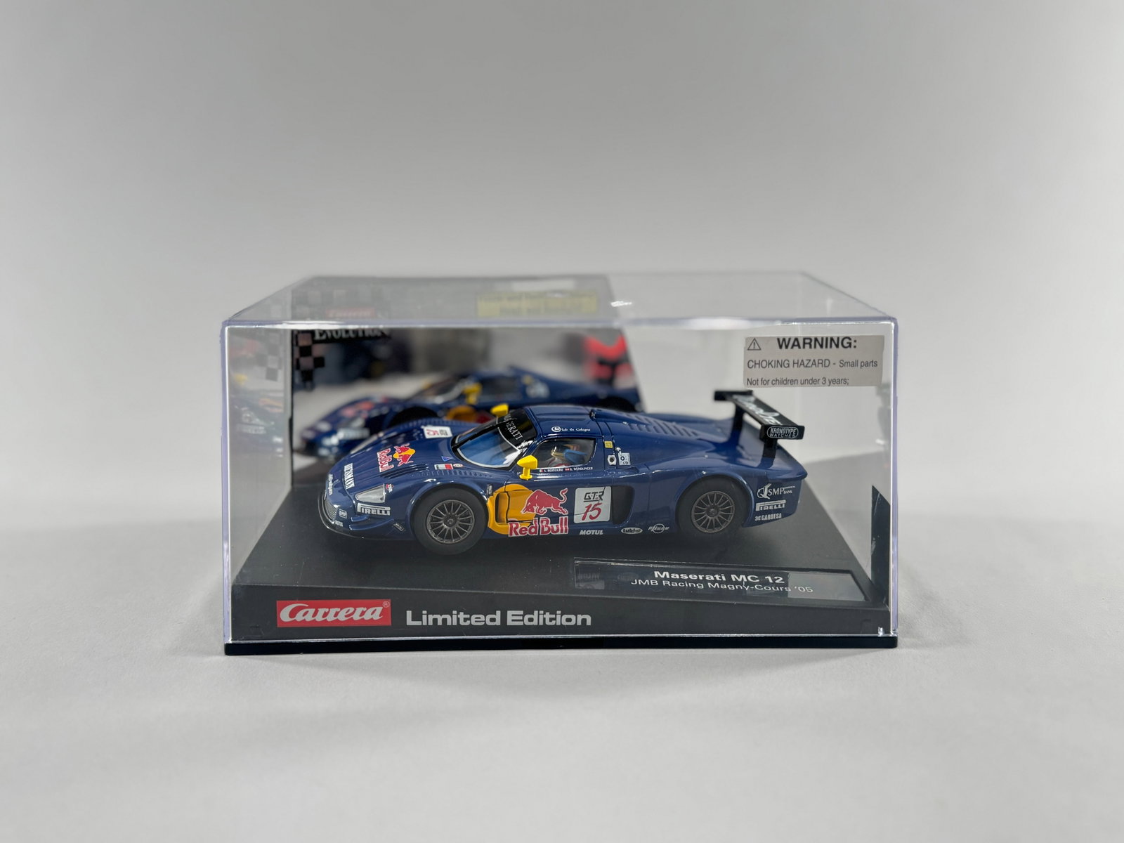 Carrera Limited Edition Maserati MC 12 #15: Carrera Limited Edition Maserati MC 12 #15 Red Bull 1/32 Slot Car. Reference #27107. Dimensions: 8" x 5 1/8" x 4". Weight: 14.8oz.