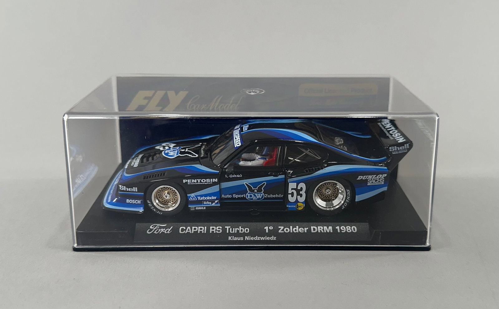 Fly Car Model Ford Capri RS Turbo #53: Fly Car Model Ford Capri RS Turbo 1° Zolder DRM 1980 Klaus Niedzwiedz 1/32 slot car in original display case. Black and blue livery #53. Weight 10 oz. Dimensions: 6 3/8'' x 3 1/4''