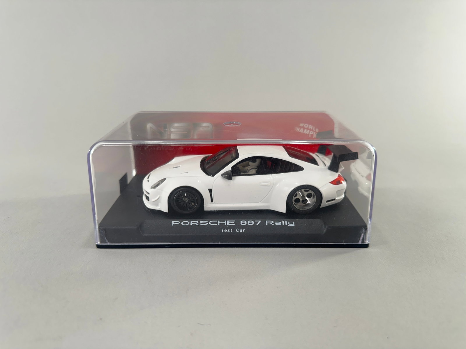 NSR Porsche 997 Rally Test Car: NSR 1064 Porsche 997 Rally Test Car 1/32 slot car. Weight: 7.6oz. AW Motor.