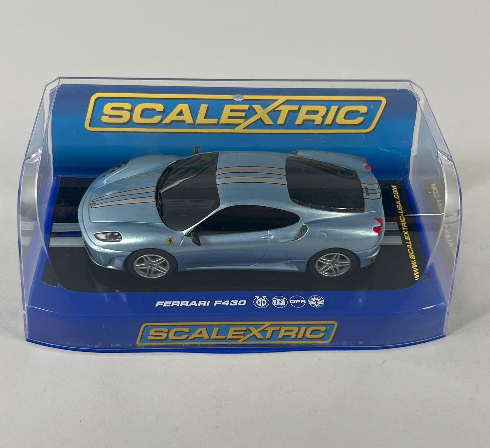 Scalextric Ferrari F430: Scalextric Ferrari F430 Azzurro Met 1/32 Slot Car, presented in its original blue and clear plastic display case. reference #C3067. Weight: 7oz. Dimensions: 3.75'' x 7.25'' x 3.75'