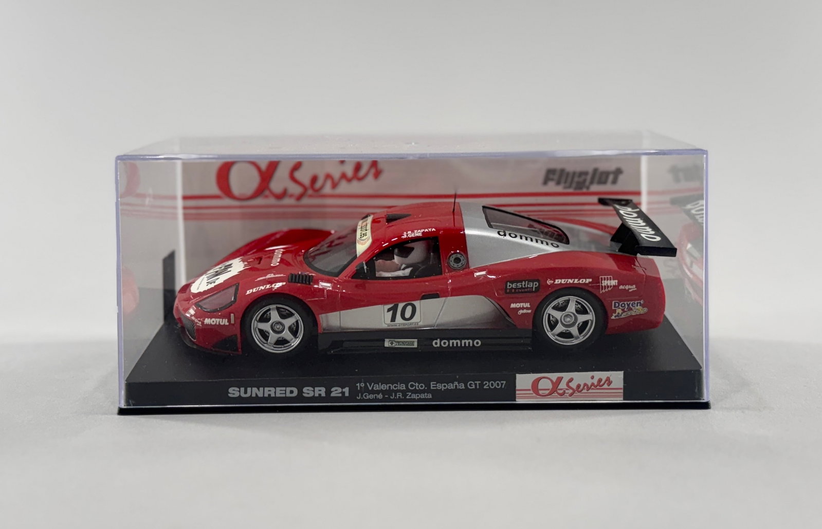 Flyslot Sunred SR21 #10: Fly Slot Sunred SR 21 #10 dommo 1/32 Slot Car. Reference #M01101. Dimensions: 6 5/8'' x 3 1/2'' x 2 7/8''. Weight: 7.2oz.