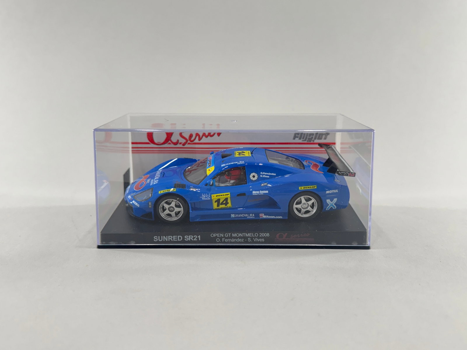 Flyslot Sunred SR21 Open GT Montmelo 2008 #14: Flyslot Sunred SR21 Open GT Montmelo 2008 #14 1/32 Slot Car. Reference #701104. It is presented in its original clear display case with a black base. Weight: 7.2oz. Dimensions: 6 5/8'' x 