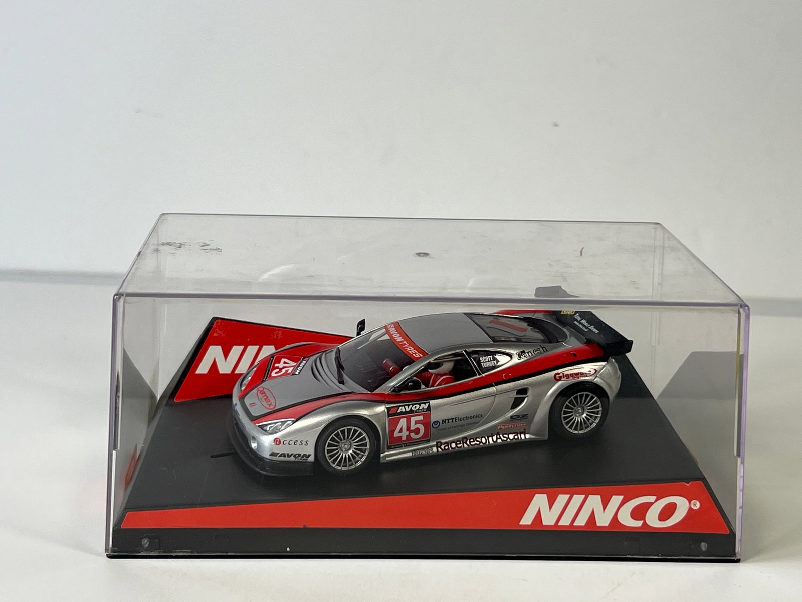 Ninco Ascari KZ1 Gigawave #45: Ninco Ascari KZ1 Gigawave #45 1/32 Slot Car. Reference #50444, with original case. Case measures 7.75 inches in length. Weight: 9 oz.