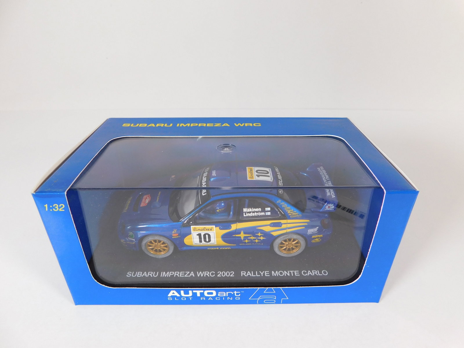 AutoArt Subaru Impreza WRC 2002 Rallye Monte Carlo #10: AutoArt Slot Racing Subaru Impreza WRC 2002 T.Makinen / Lindstrom Rallye Monte Carlo #10 1/32 Slot Car, with original case. Weight: 10.2 oz.