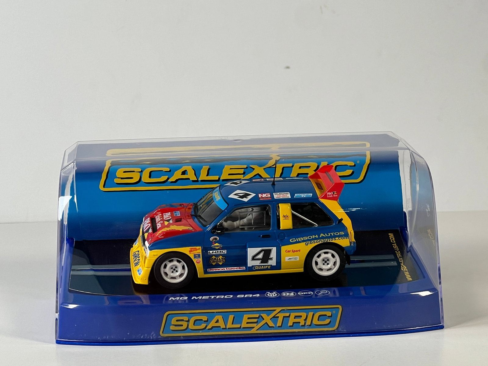 Scalextric MG Metro 6R4 British Rallycross Championship #4: Scalextric MG Metro 6R4 Lawrence Gibson British Rallycross Championship #4 1/32 Slot Car. Reference #C3494, with original case. Weight: 9 oz.