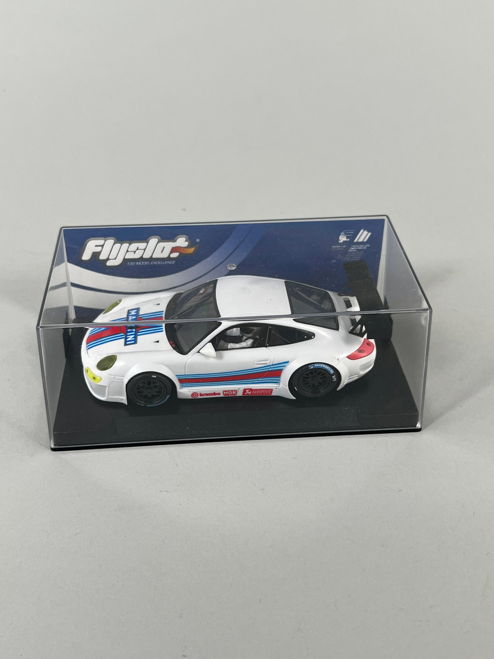 Flyslot Martini Racing Porsche 997 RSR: Flyslot Martini Racing Porsche 997 RSR Martini 1/32 Slot Car. Reference #704105. Weight: 7oz. 