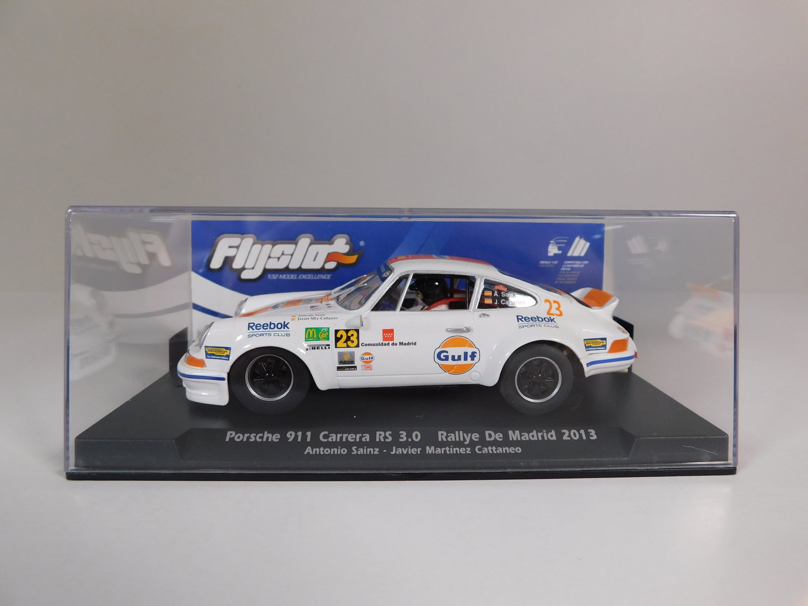 Flyslot Porsche 911 Carrera RS 3.0 Rallye de Madrid 2013 #23: Flyslot Porsche 911 Carrera RS 3.0 Rallye de Madrid 2013 Sainz-Martinez #23 Gulf 1/32 Slot Car. Reference #036106, with original case. Weight: 6.4oz.
