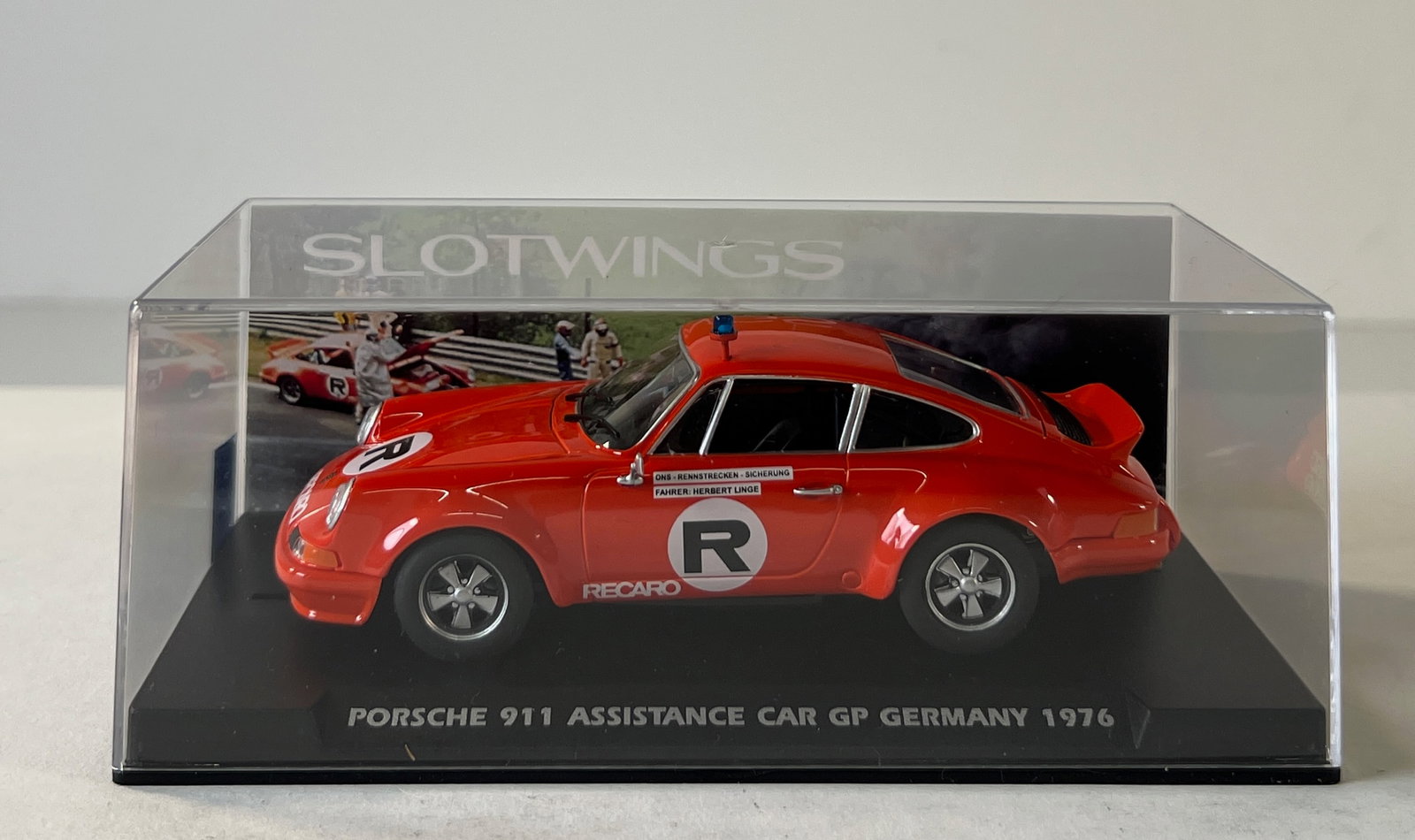 Slotwings Porsche 911 Assistance Car GP Germany 1976: Slotwings Porsche 911 Assistance Car GP Germany 1976 R Recaro 1/32 Slot Car. Reference #W036-01, with original case. Case measures 2.5 x 6.5 inches. Weight: 7 oz.