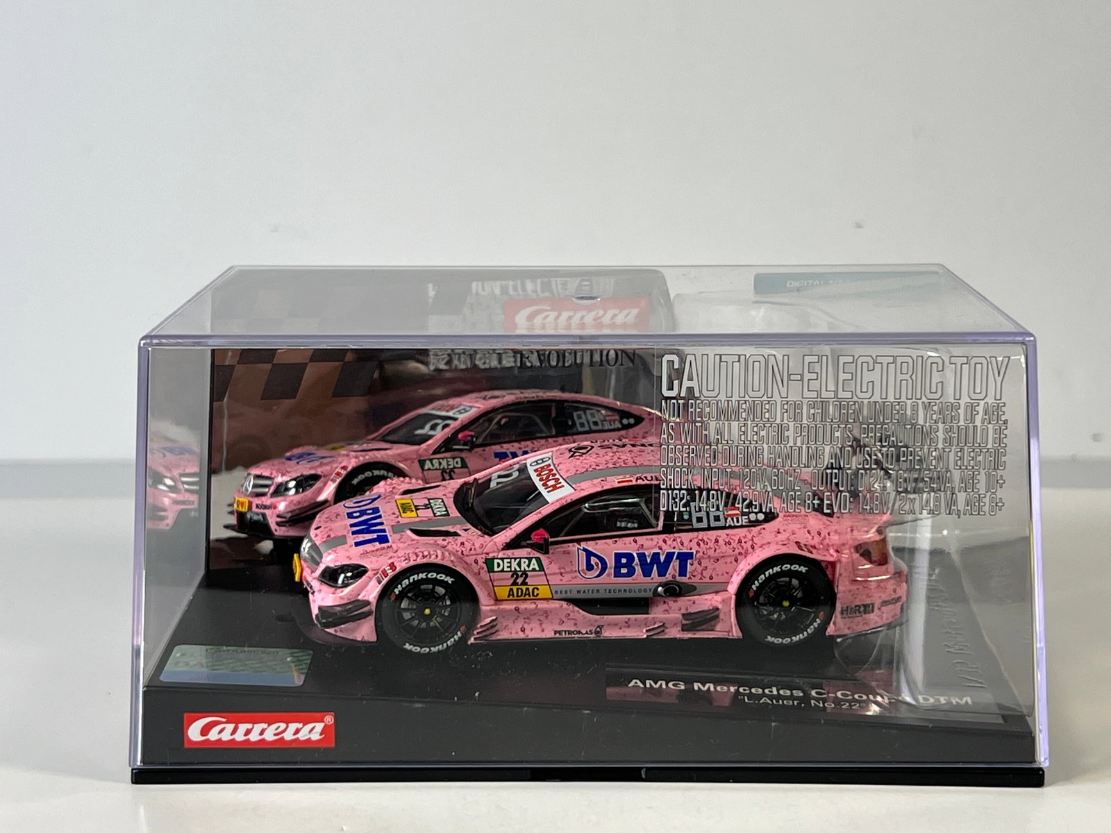 Carrera Evolution AMG Mercedes C-Coupe DTM #22: Carrera Evolution AMG Mercedes C-Coupe DTM L. Auer #22 BWT 1/32 Slot Car, with original case. Case measures 8 inches in length and the total weight is 16 oz.