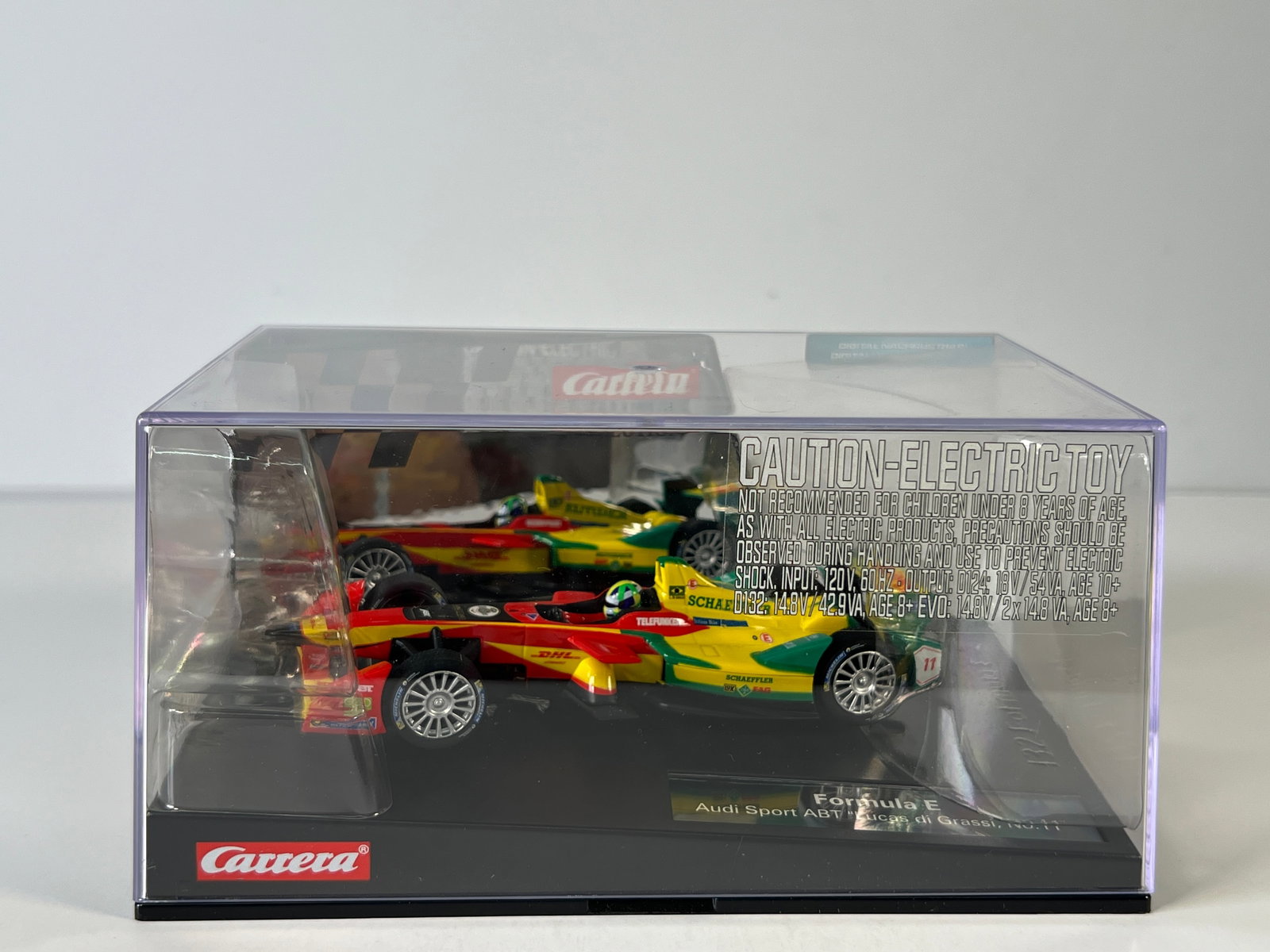 Carrera Formula E Audi Sport ABT Lucas di Grassi #11: Carrera Formula E Audi Sport ABT Lucas di Grassi #11 DHL 1/32 Slot Car, with original case. Case length: 8 inches. Weight: 15 oz. Digitally upgradeable.