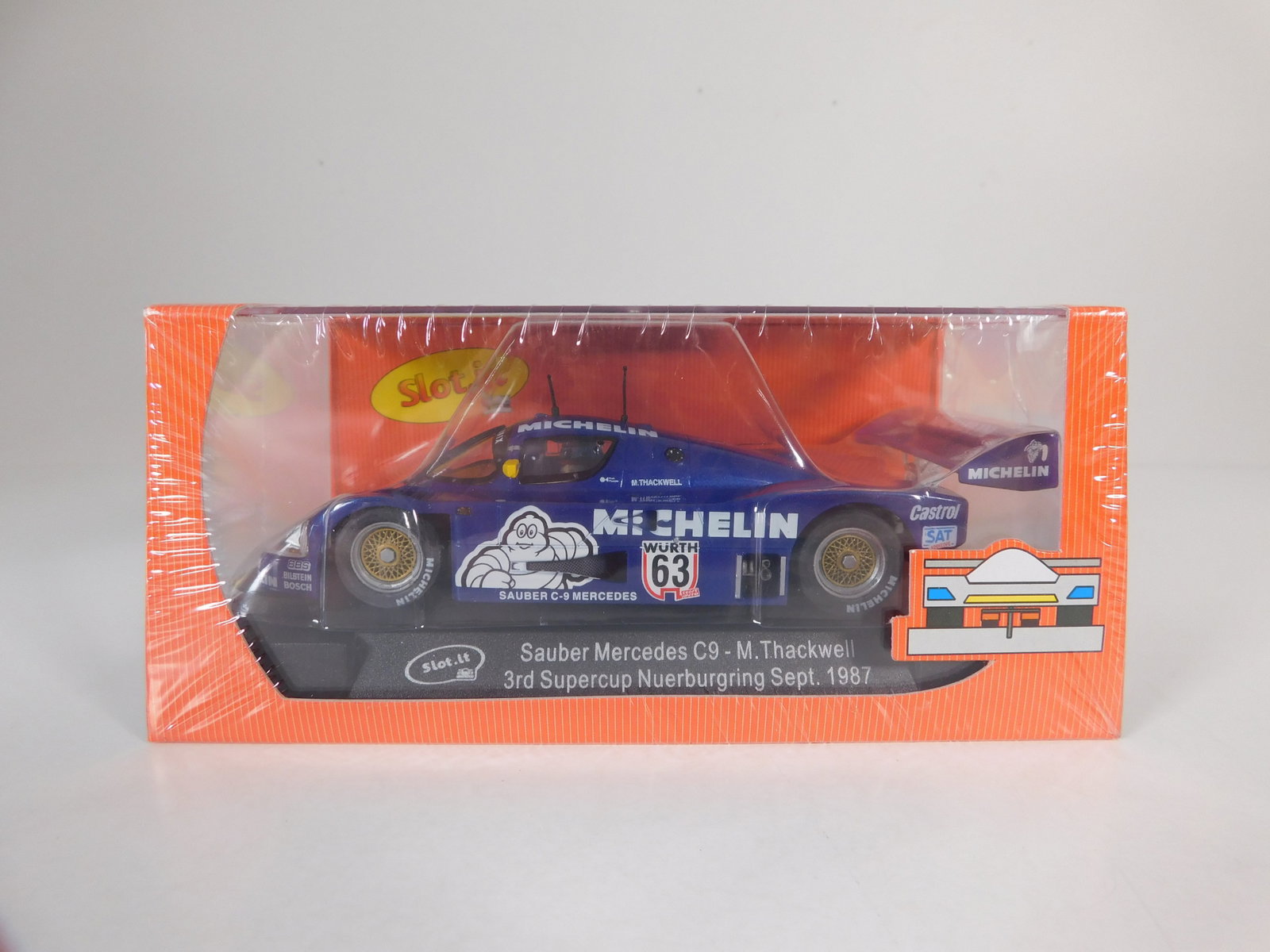 Slot.it Sauber Mercedes C9 - 3rd Supercup Nuerburgring 1987 #63: Slot.it Sauber Mercedes C9 - M. Thackwell 3rd Supercup Nuerburgring Sept. 1987 #63 Michelin 1/32 Slot Car. Reference #CA06e, with original case. Weight: 7.5 oz. Shrink-wrapped, new in box.