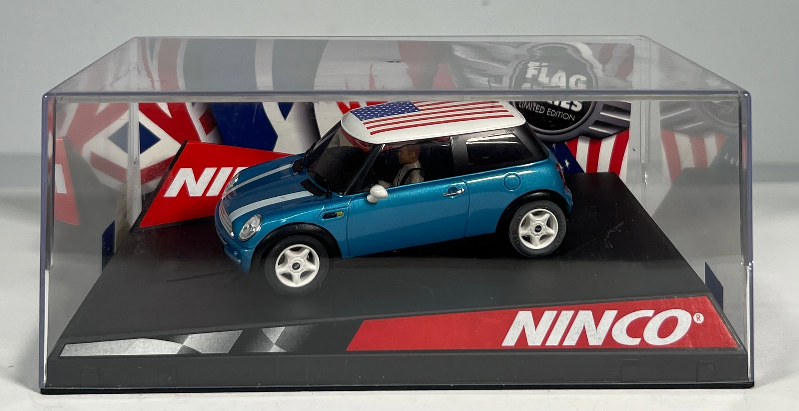 Ninco Mini Cooper 'Stars & Stripes' Flag Series: NINCO Mini Cooper Stars & Stripes 1/32 Slot Car. Reference #50302, with original case. Weight: 9 oz.