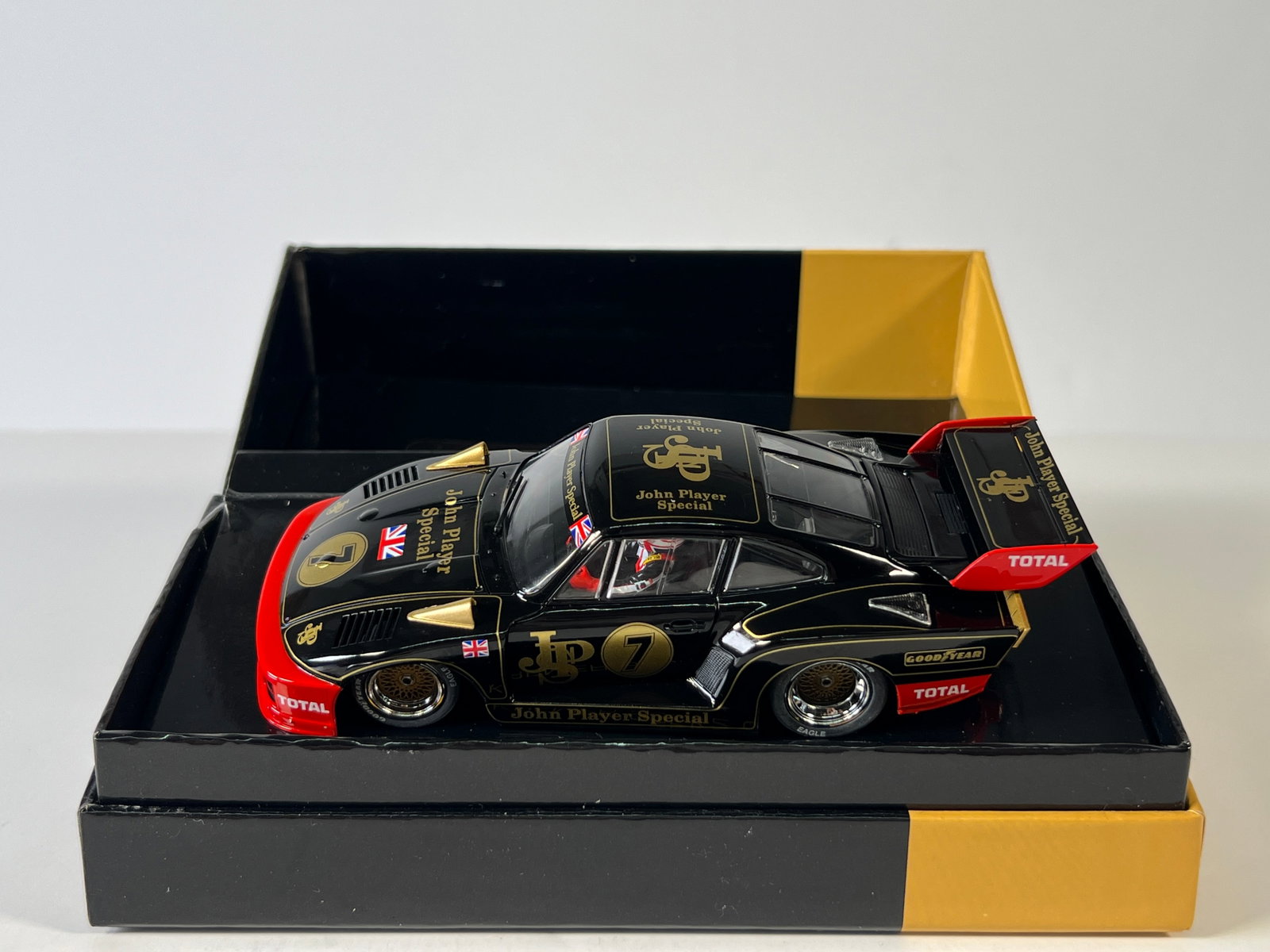 Sideways Kremer 935K2 Gr.5 #7 John Player Special: Sideways Kremer 935K2 Gr.5 #7 John Player Special 1/32 Slot Car, with original case. Case measures 7.25 inches in length and the total weight is 10 oz.